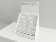 Espositore da banco con ripiani con sedi in plexiglass bianco